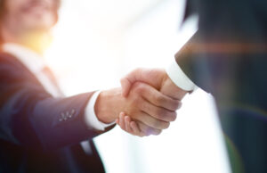 Two men shaking hands in a business partnership